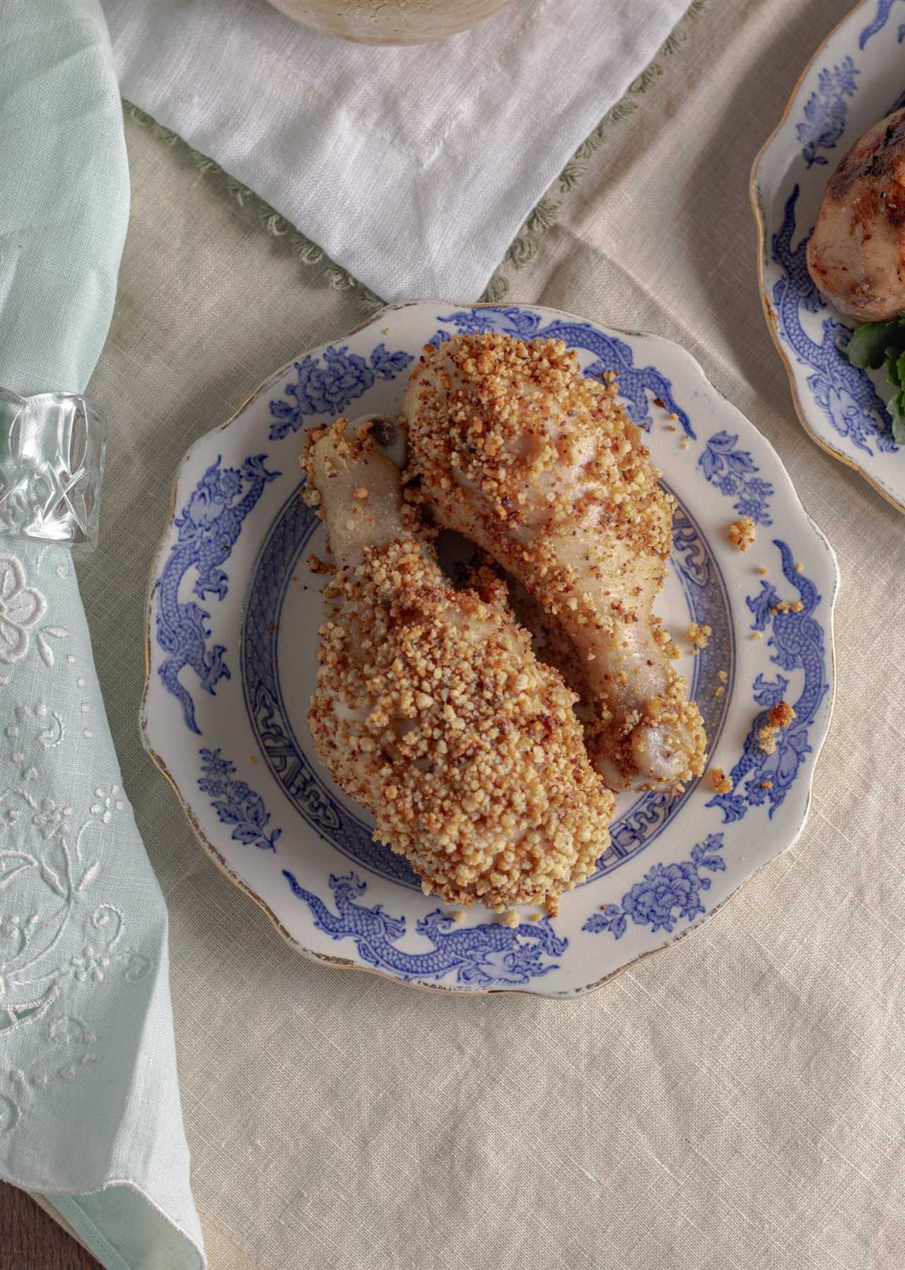 Crispy baked chicken drumsticks are marinated chicken legs are coated in a homemade gluten free breading. Keto shake and bake chicken copycat recipe.