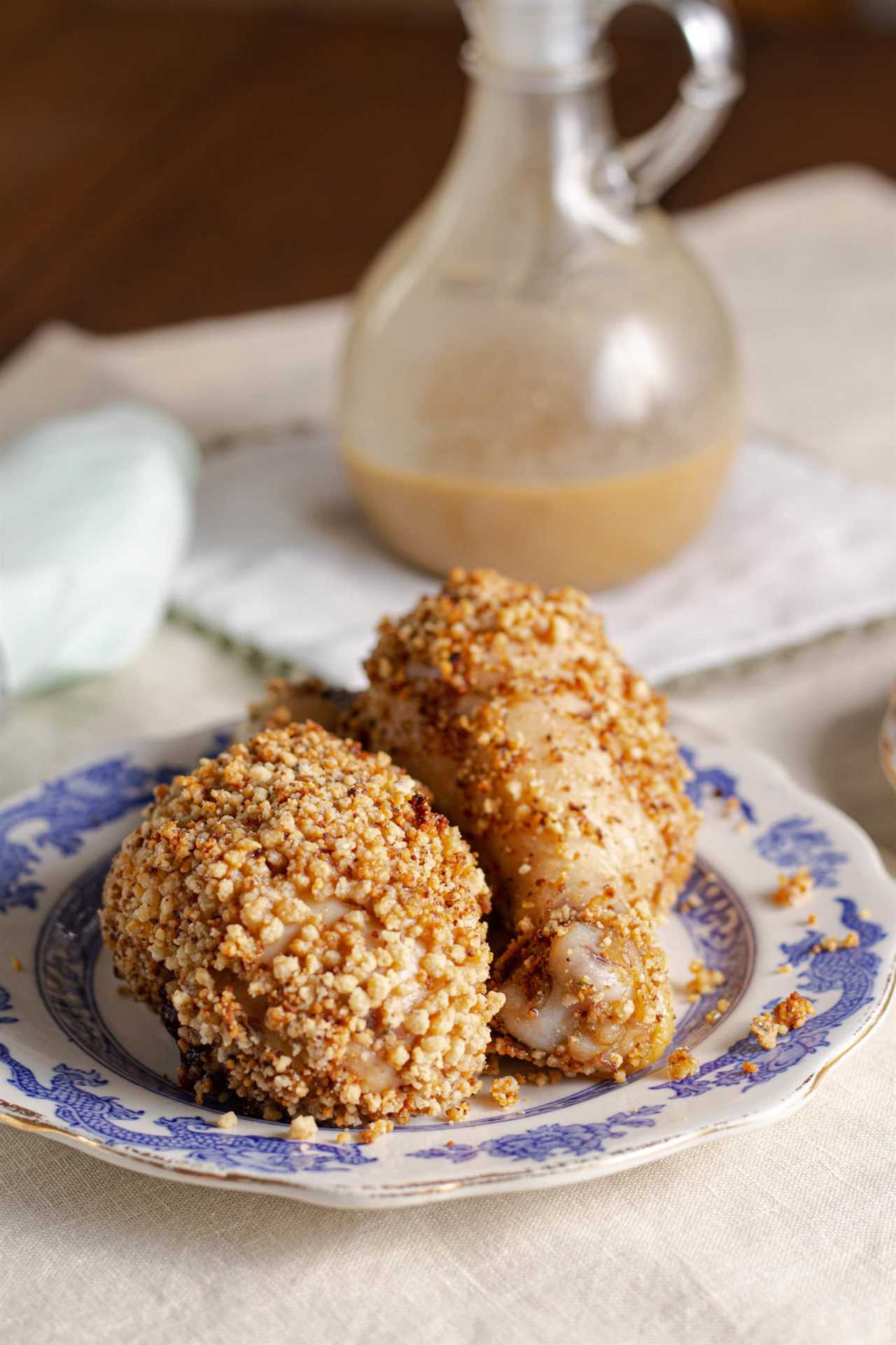 Crispy baked chicken drumsticks are marinated chicken legs are coated in a homemade gluten free breading. Keto shake and bake chicken copycat recipe.