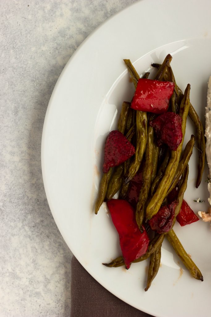 Crisp green beans are roasted with sweet strawberries in a balsamic glaze. A low carb and low calorie side dish for the summer!