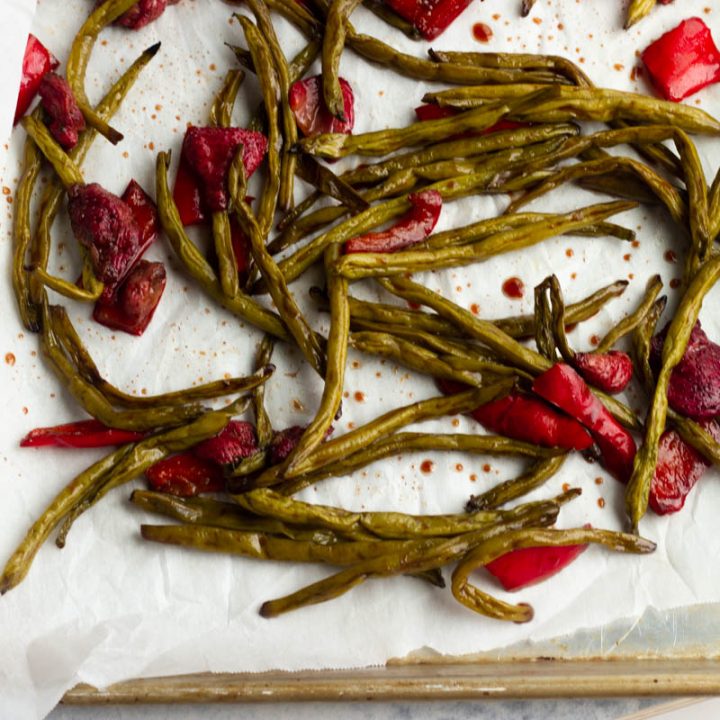 Crisp green beans are roasted with sweet strawberries in a balsamic glaze. A low carb and low calorie side dish for the summer!