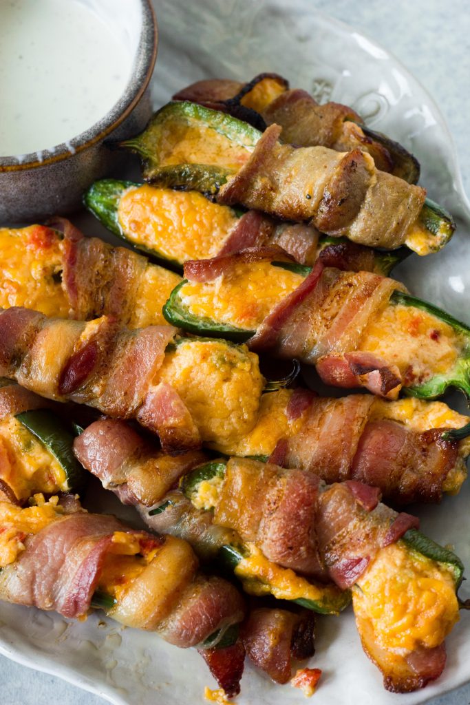 These keto jalapeño poppers are not your average keto snack. Pimento cheese steals the show in this 3 ingredient keto jalapeno popper recipe.