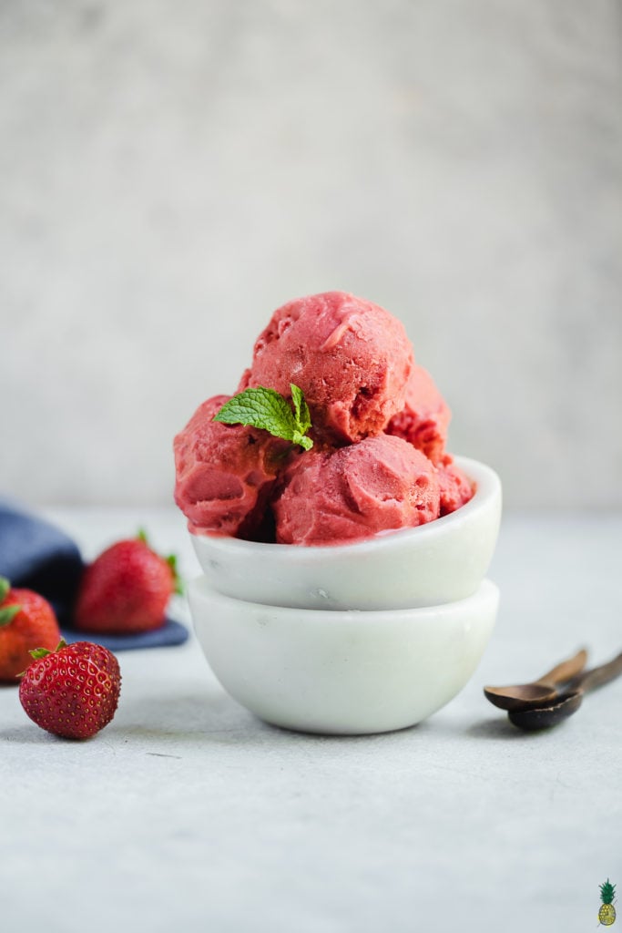 strawberry frozen yogurt in white bowls food photography by sweet simple vegan