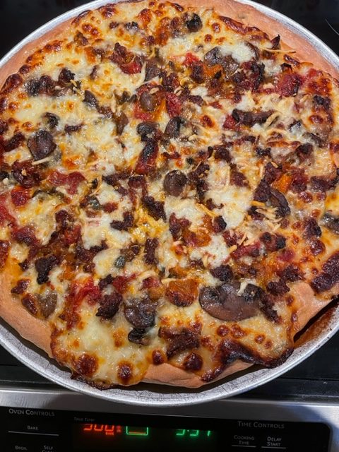 Homemade Pizza With Roasted Tomato, Sausage And Mushroom Sauce