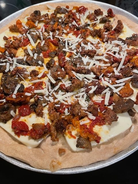 Homemade Pizza With Roasted Tomato, Sausage And Mushroom Sauce