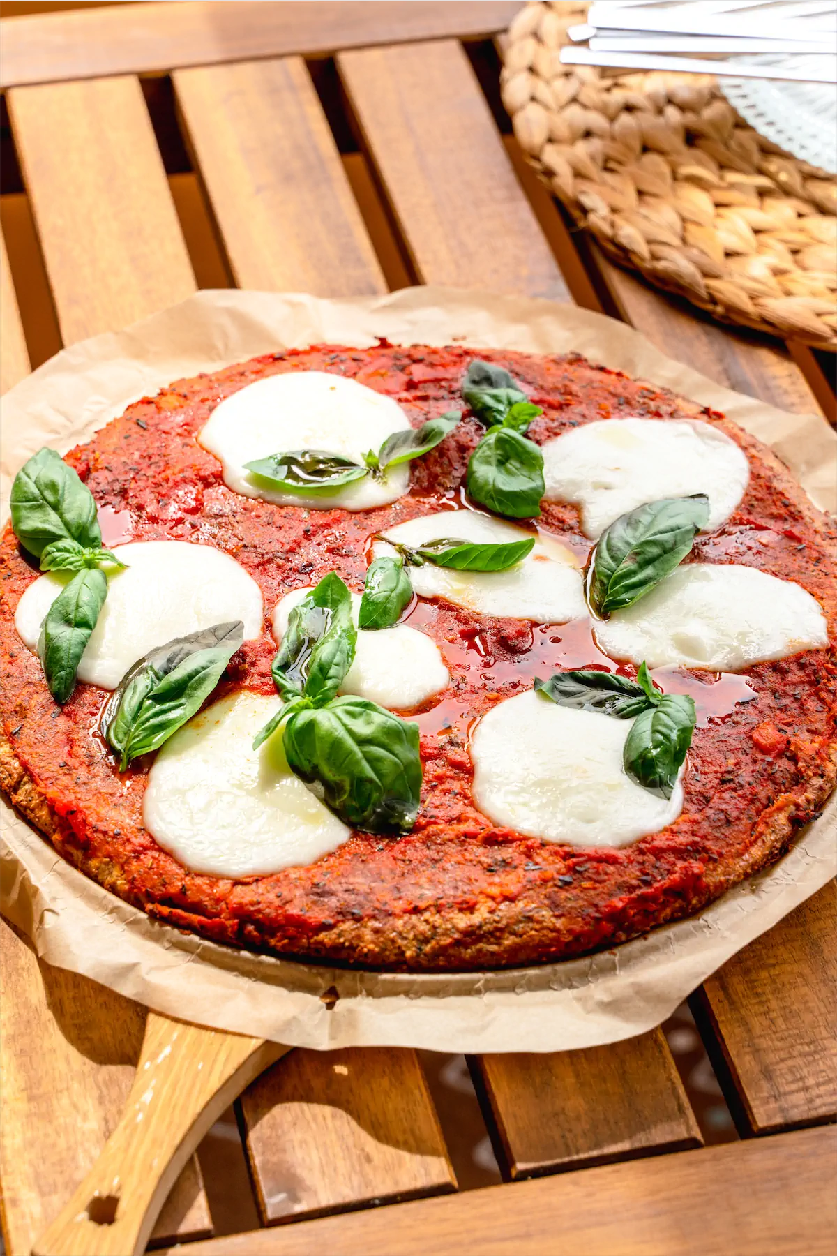 Full round pizza on a pizza serving board.