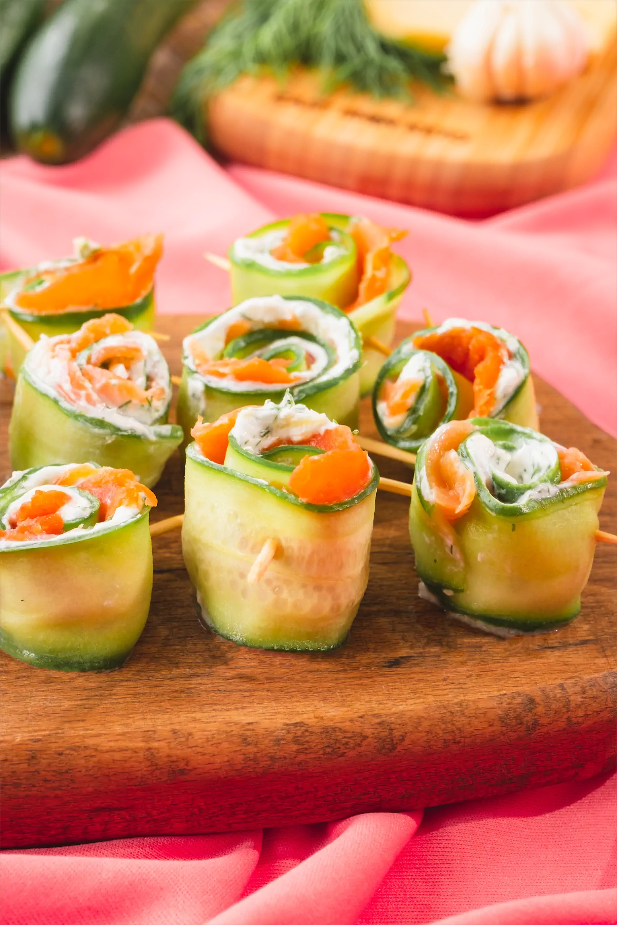 Keto salmon cucumber rolls on tray.