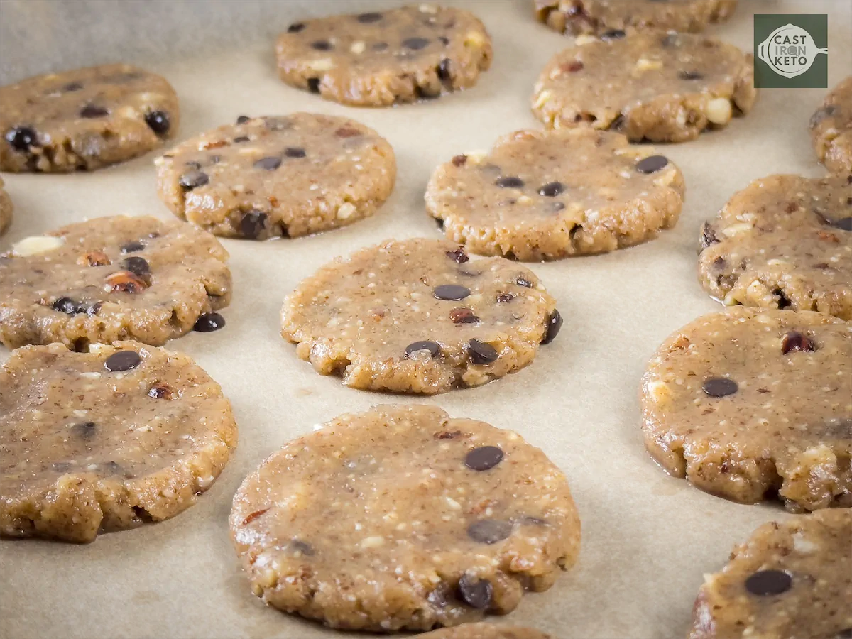 Keto dough with choco chips made flat and ready to be baked.