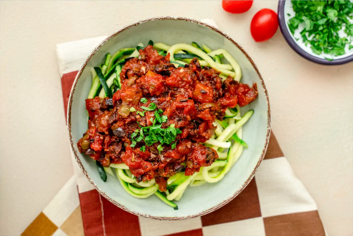 Plate of keto noodles topped with keto sauce.