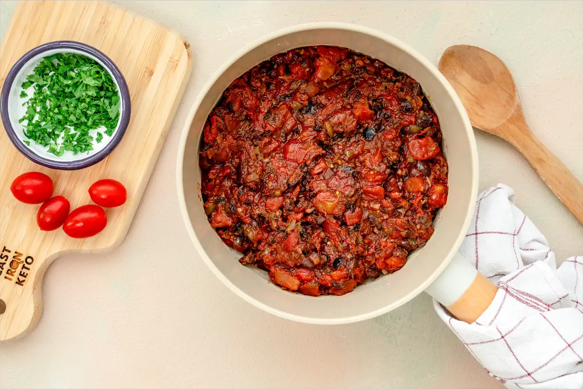 A pan with freshly prepared puttanesca sauce.