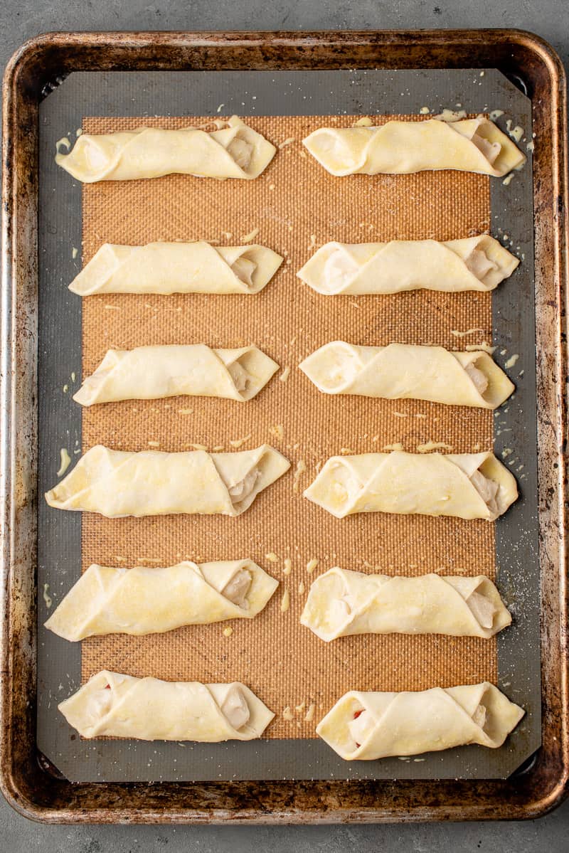 uncooked vegan quesitos on a baking sheet