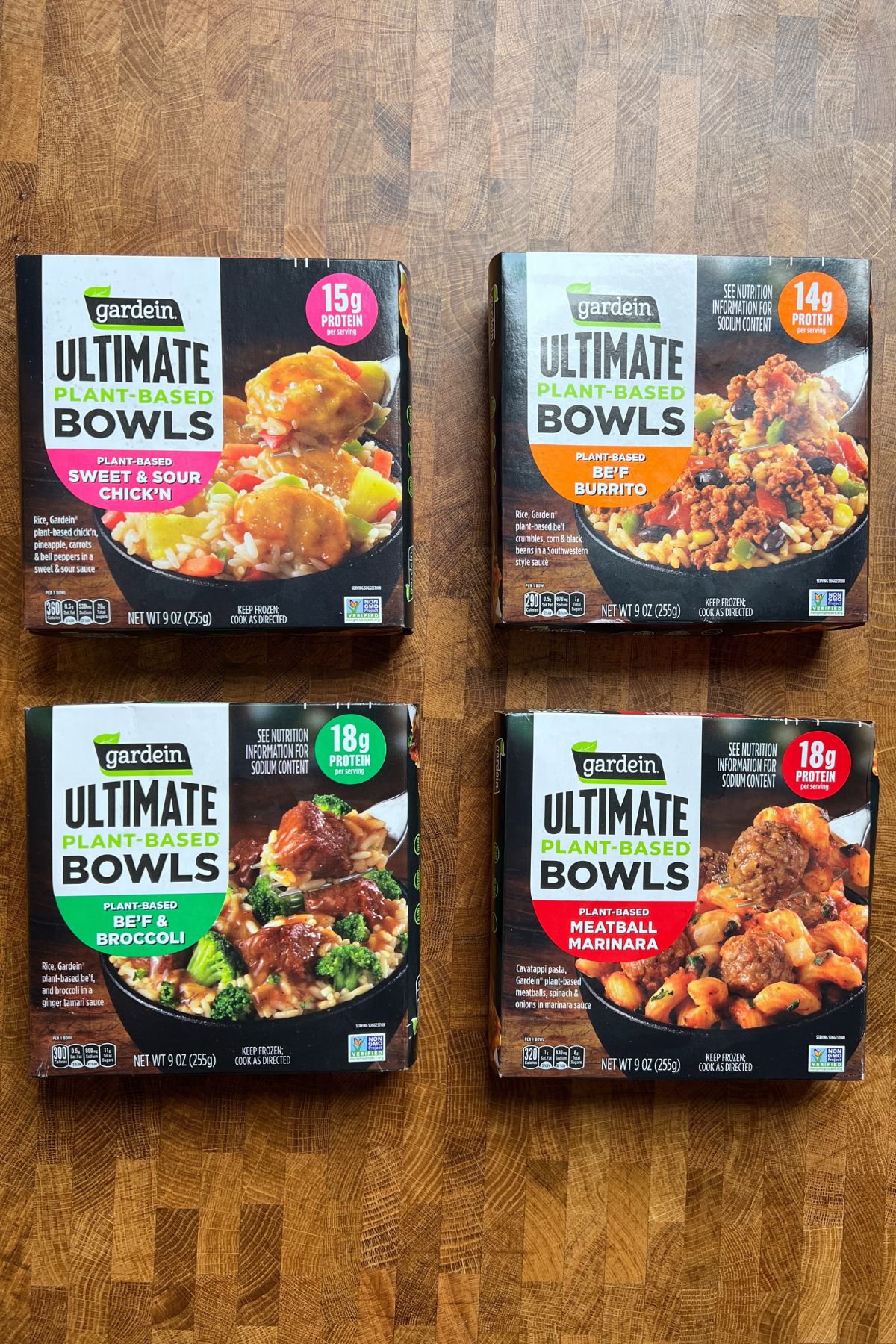 four packages of different Gardein Ultimate bowls on a table.