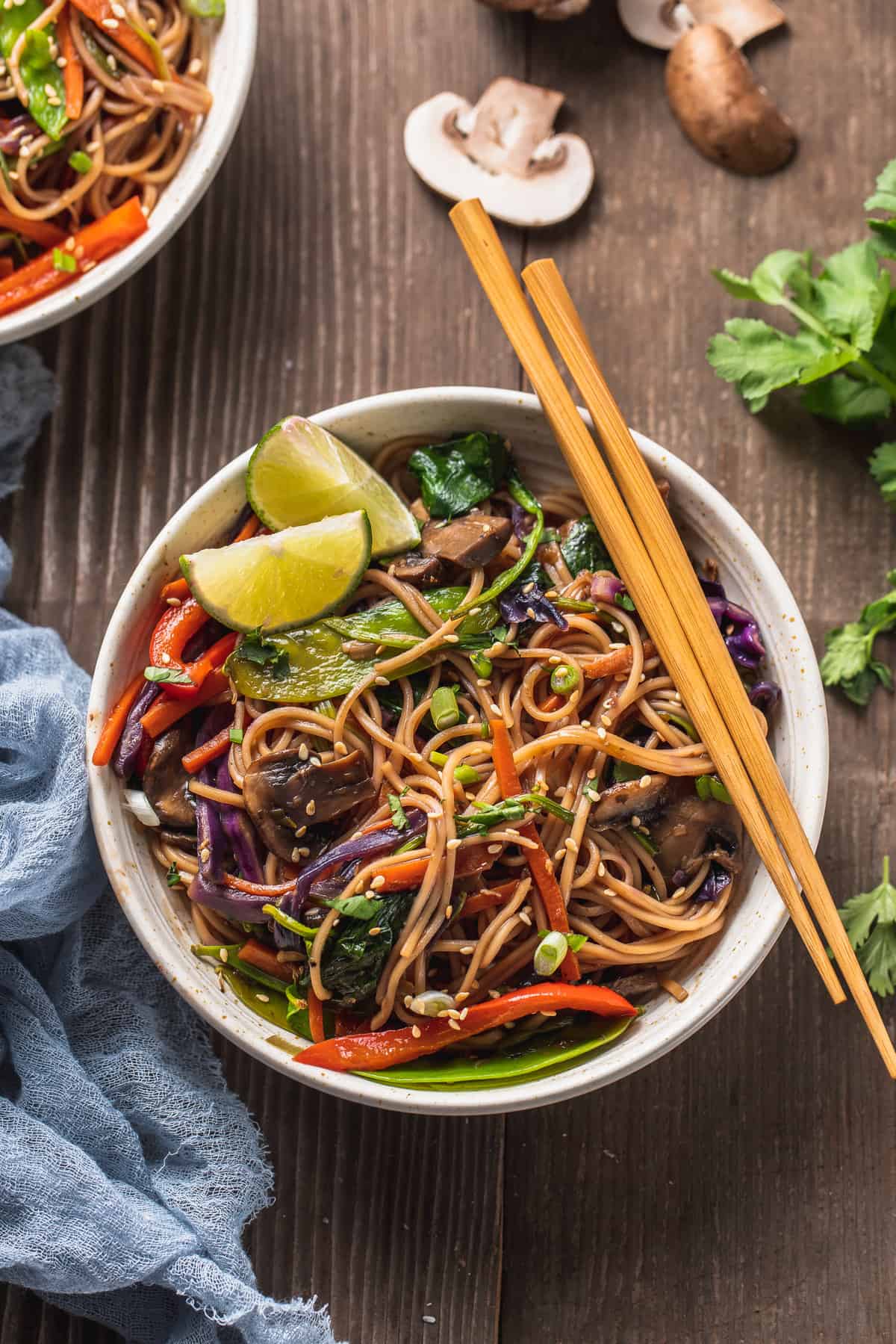 overhead image of bowl filled with stir fry and chop sticks on the side