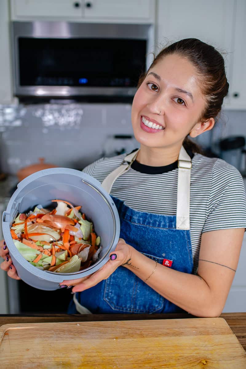 girl holding compost for a Lomi Bloom