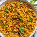 vegetable biryani in a large white bowl.