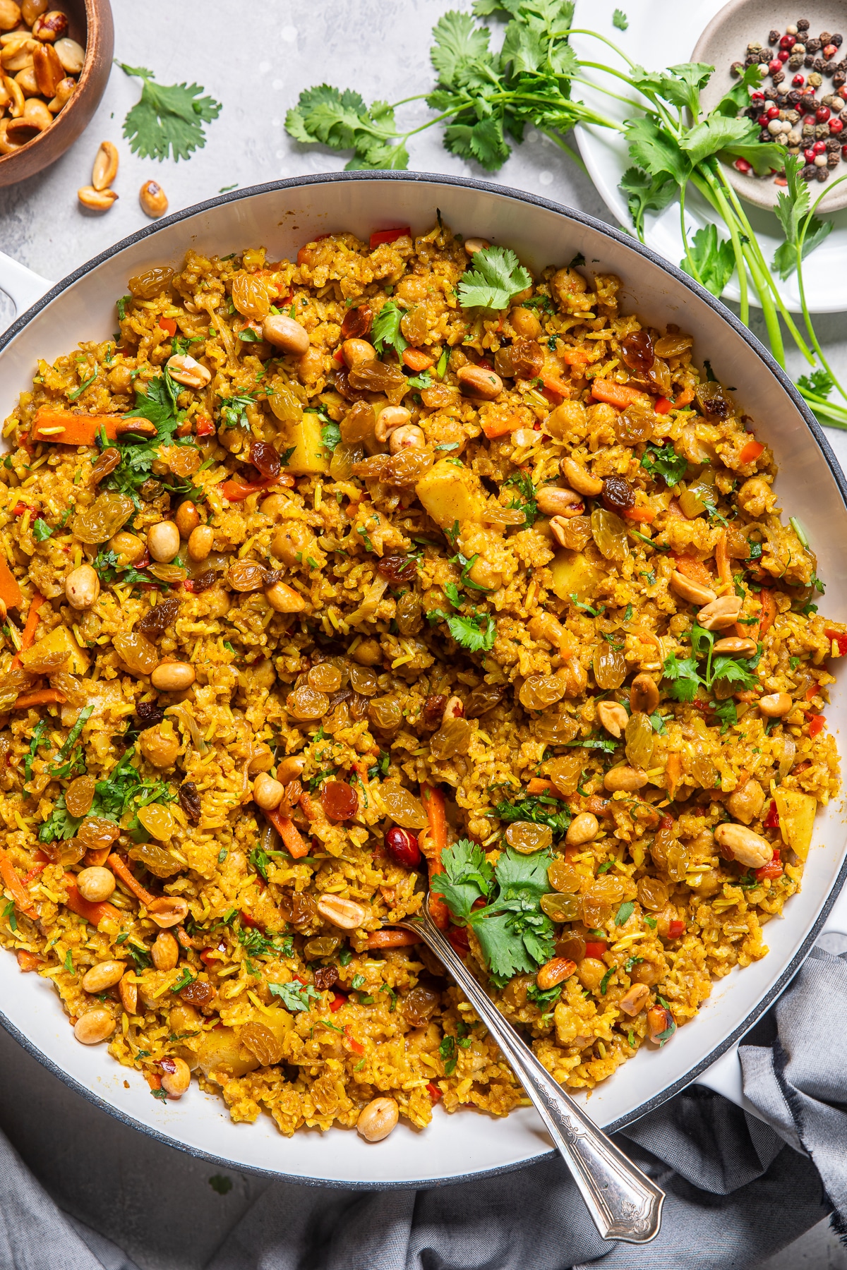 vegetable biryani in a large white bowl. 