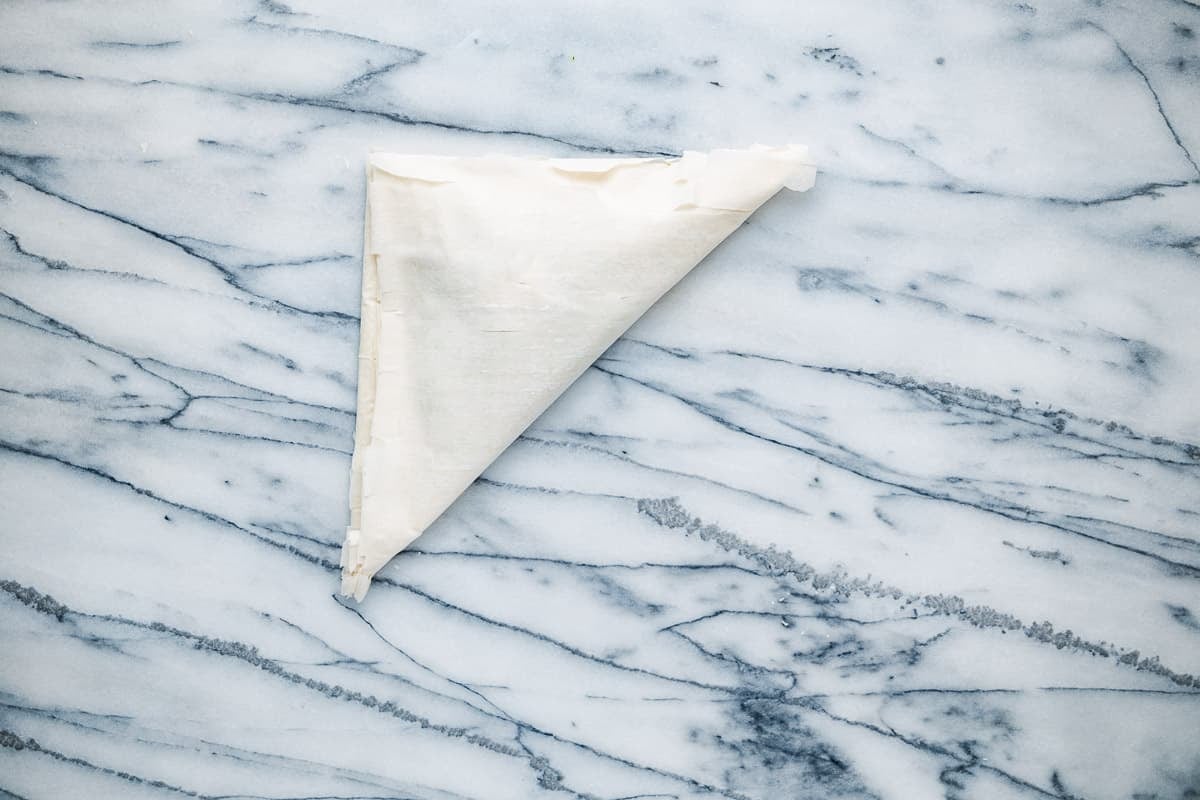 an uncooked brik triangle on a countertop.