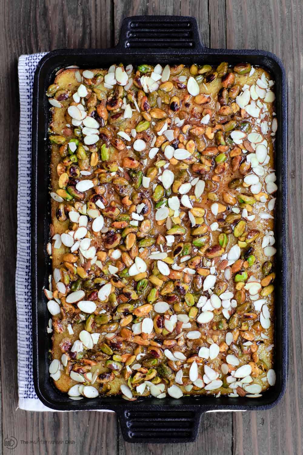 Entire Honey Cake in large pan. Topped with pistachios and slivered almonds