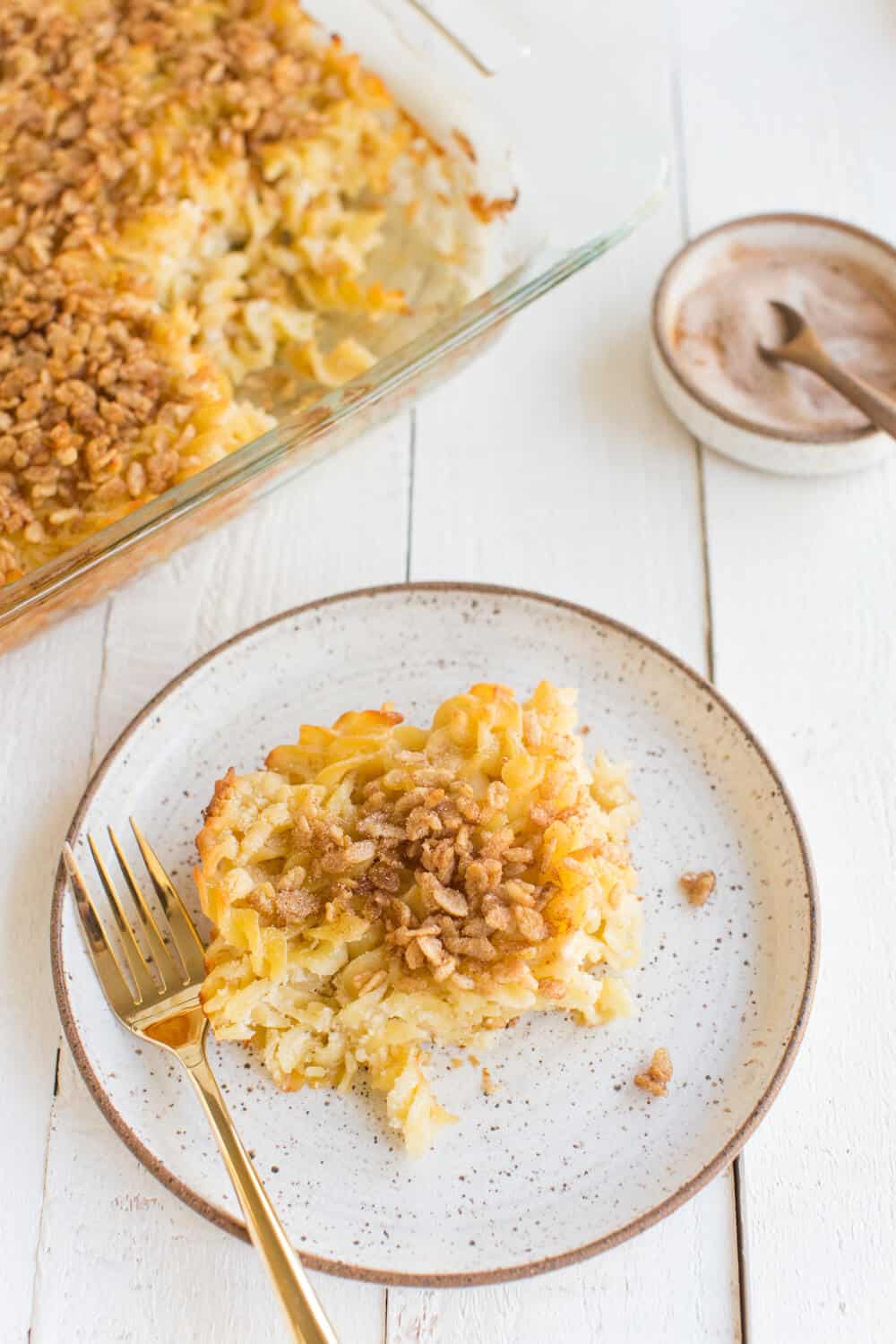 vegan noodle kugel on a plate with a fork