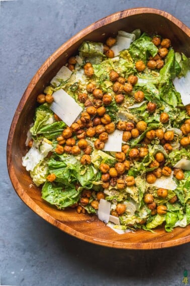 over head of brussels sprouts caesar salad in large wooden bowl