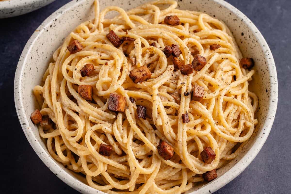 close up photo of Easy Vegan Carbonara in white bowl