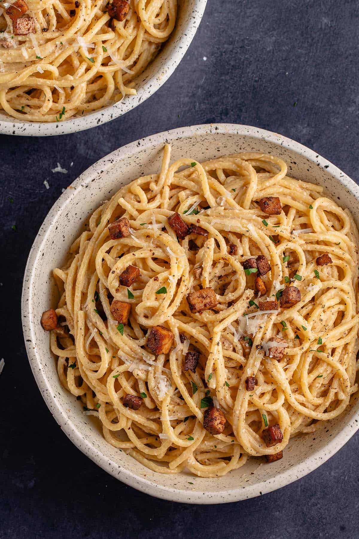 close up photo of Easy Vegan Carbonara in white bowl