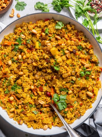 vegetable biryani in a large white bowl.