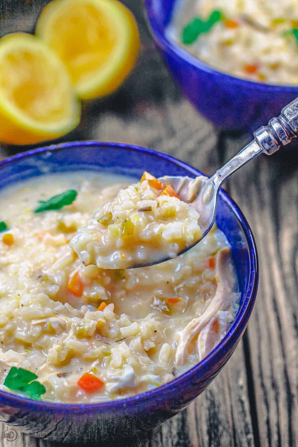 Greek avgolemono soup being spooned up