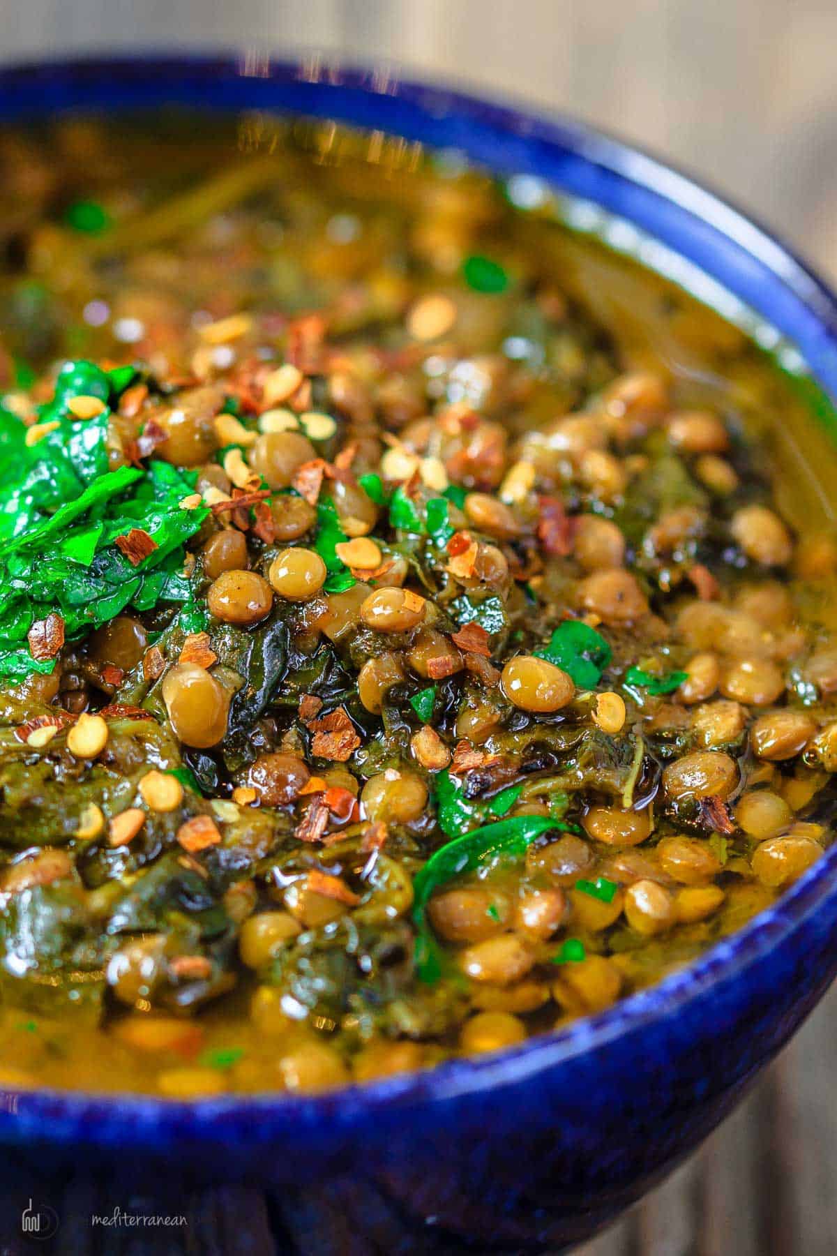 close up of lentils, spinach, and fresh parsley