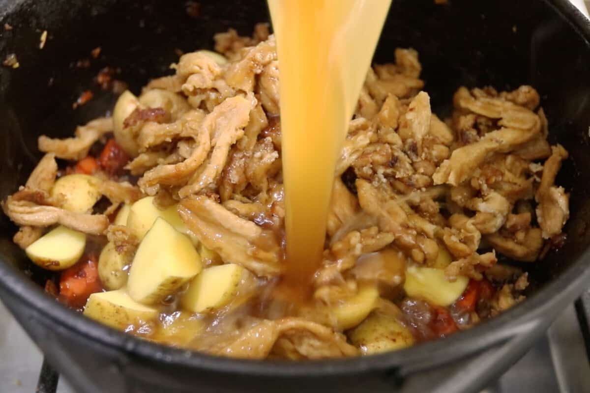 step by step - soy curls and broth being added into the pot