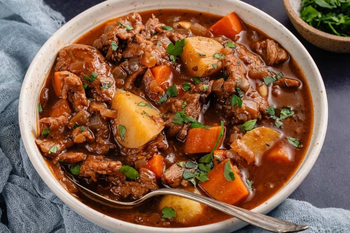 beef stew in a bowl with a spoon