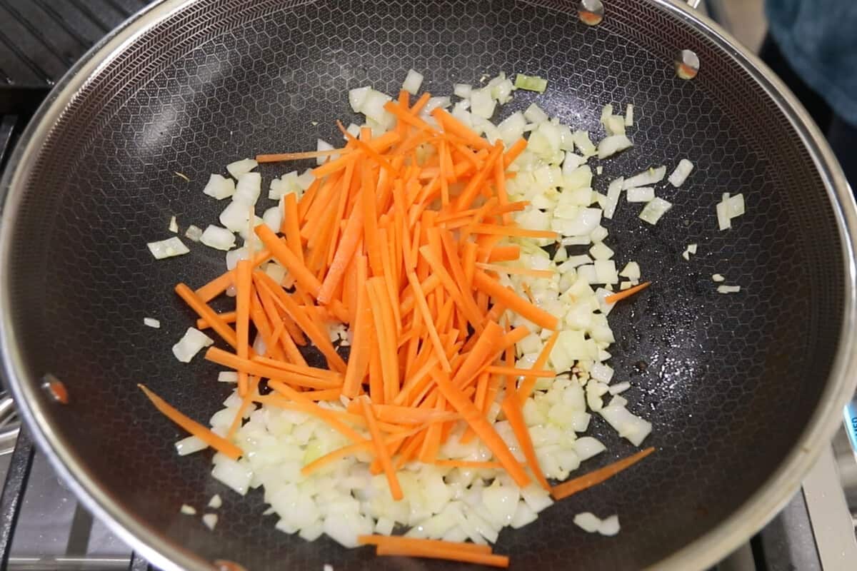 step by step - carrots added to the garlic and onions