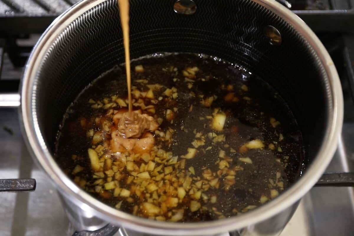 step by step - peanut butter being added to pot