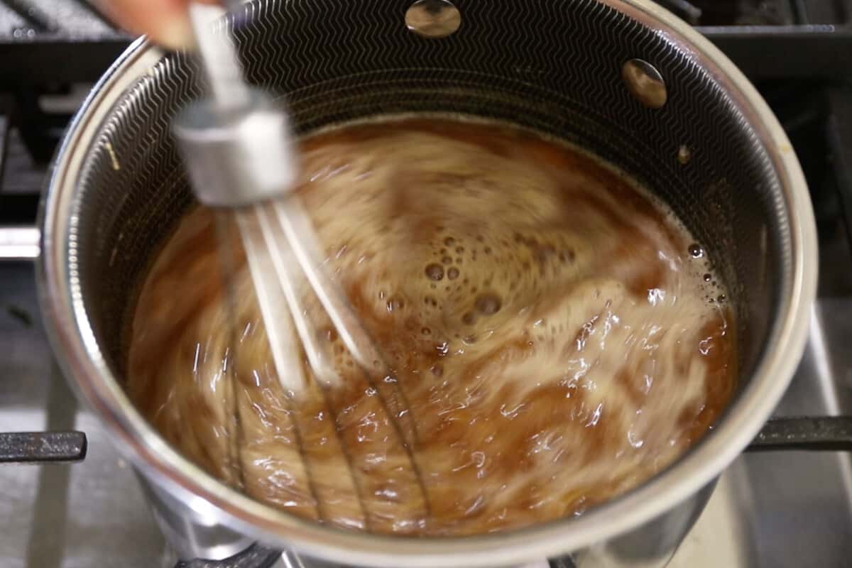 step by step - sauce being stirred in pot