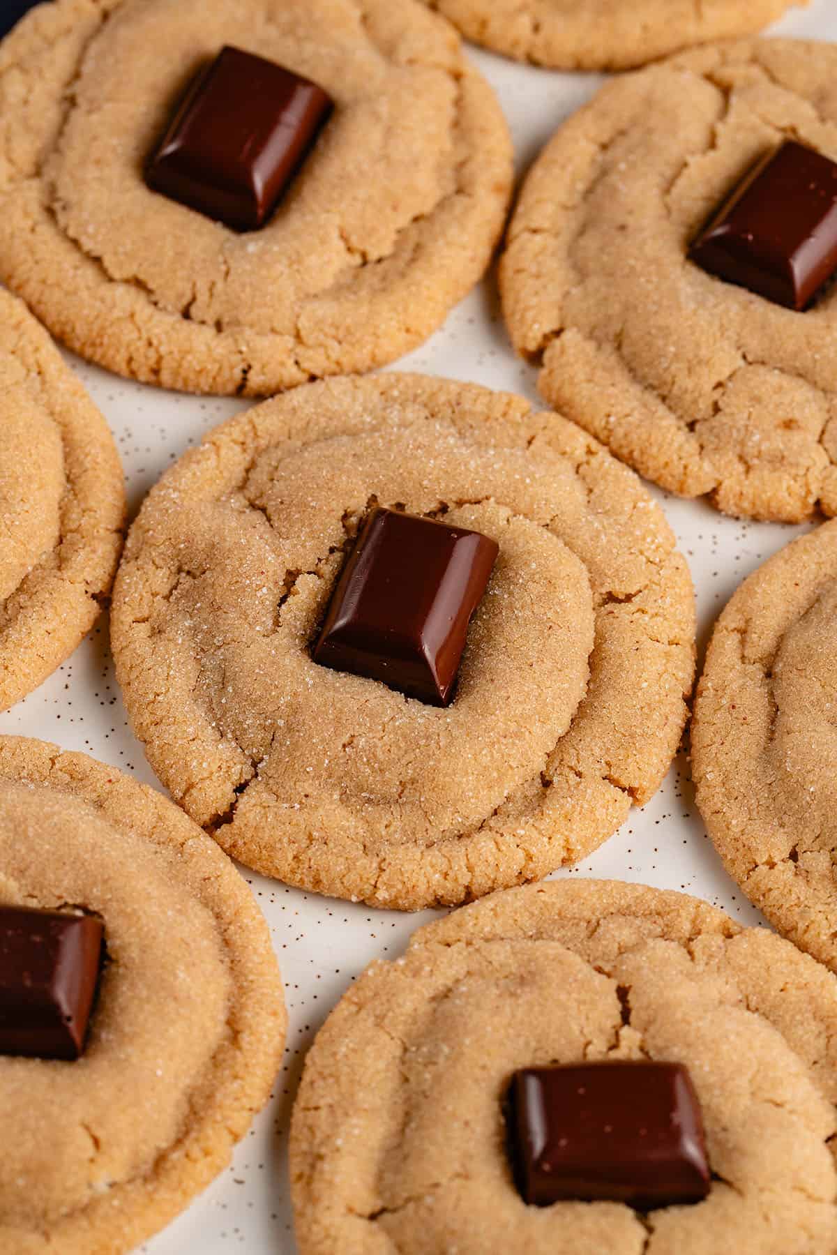 peanut butter blossom cookies on white tray sitting closely together