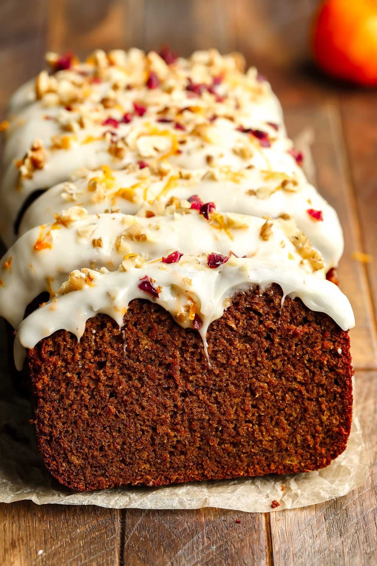 a sliced Gingerbread Loaf decorated with cream cheese frosting.