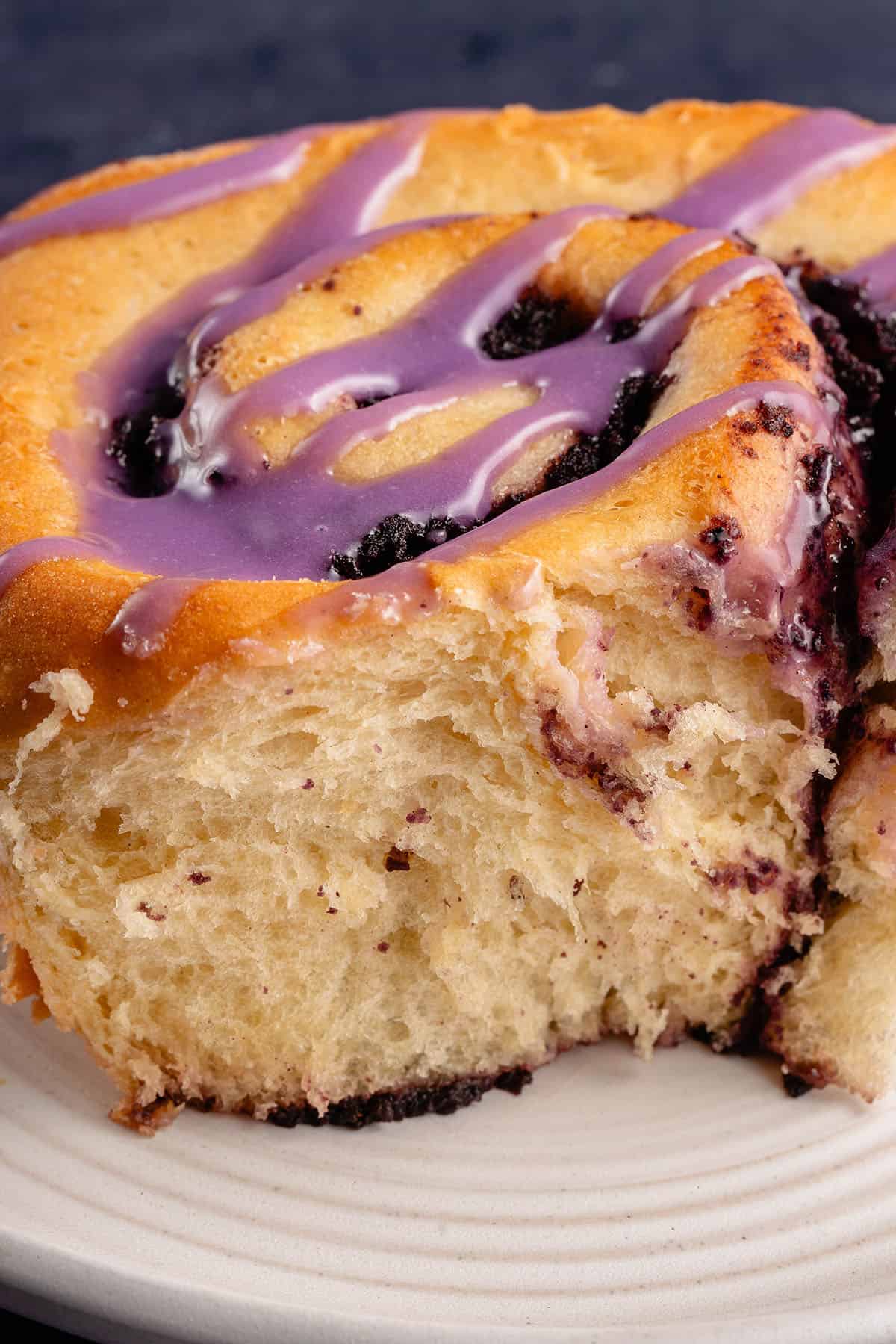 close up of side of fluffy ube cinnamon roll