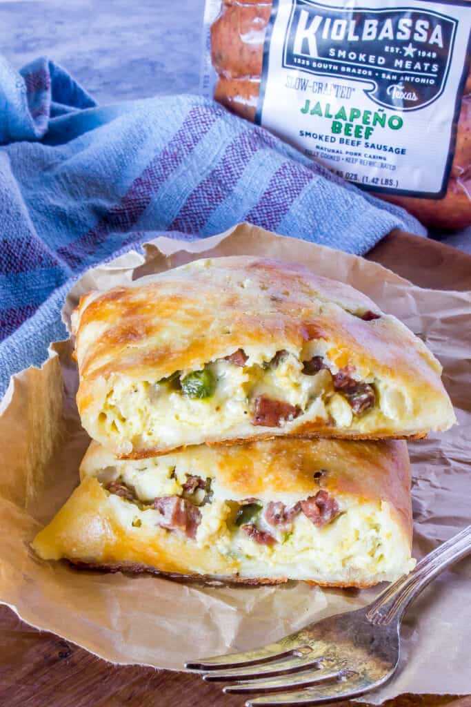 Keto Breakfast Sausage Hot Pockets on brown parchment, kiolbassa packaging in the background.