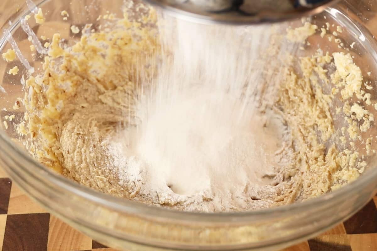 adding sifted flour into the wet ingredients