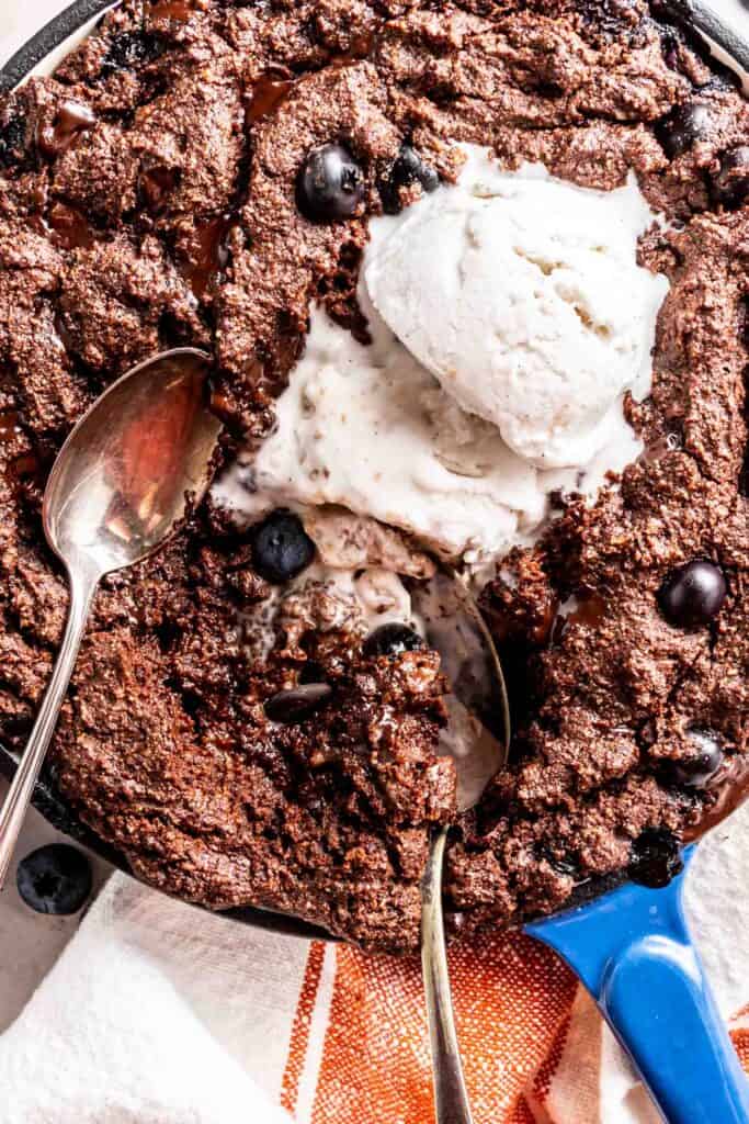 Blueberry Hot Fudge Cake in a blue enameled cast iron skillet