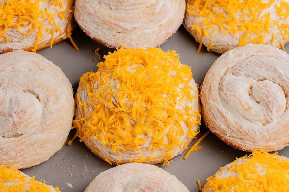 horizontal photo of Vegan Ensaymada (Sweet Filipino brioche) with cheese