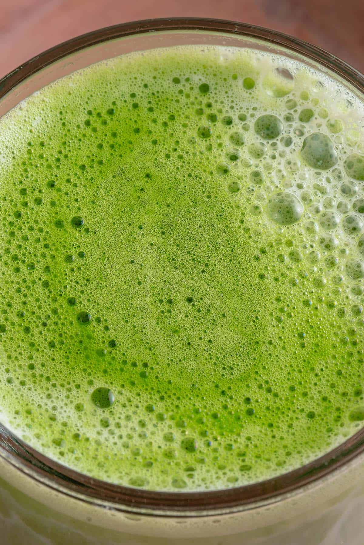 close up overhead photo of a frothy matcha latte