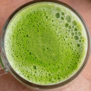 close up overhead photo of a frothy matcha latte