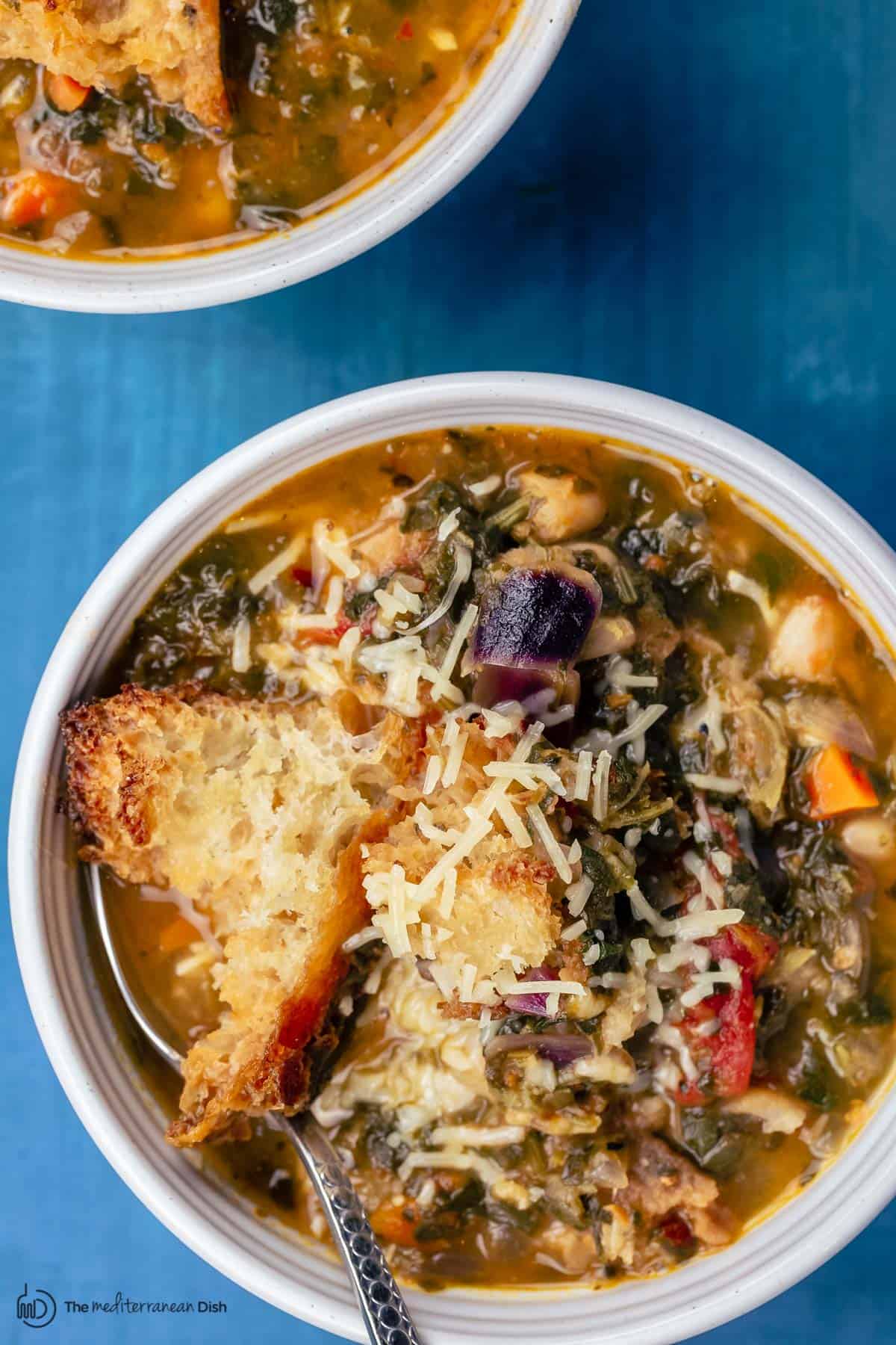 Ribollita served with a garnish of Paremsan