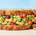 A close up of a vegan chickpea salad sandwich.