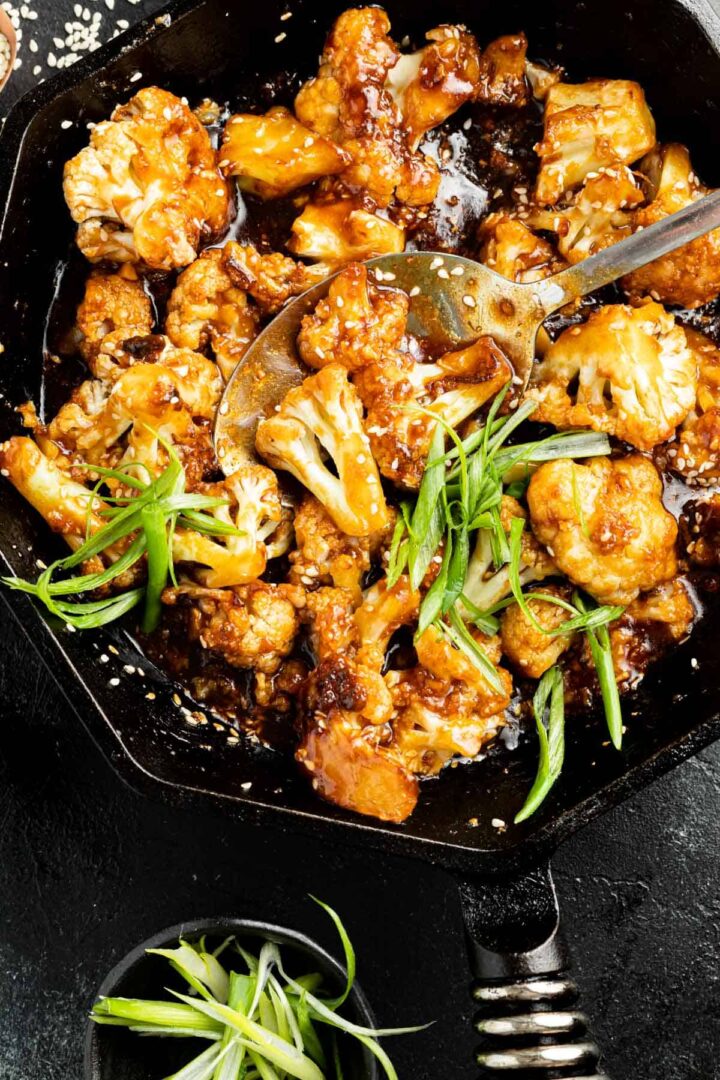 Sticky Sesame Cauliflower in a cast iron skillet