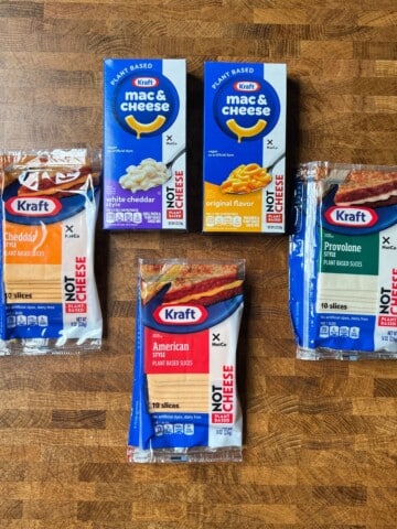 5 packages of plant based cheese products from kraft x notco arranged on a table.