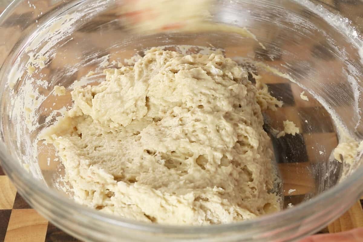 making vegan Hawaiian bread dough in glass bowl