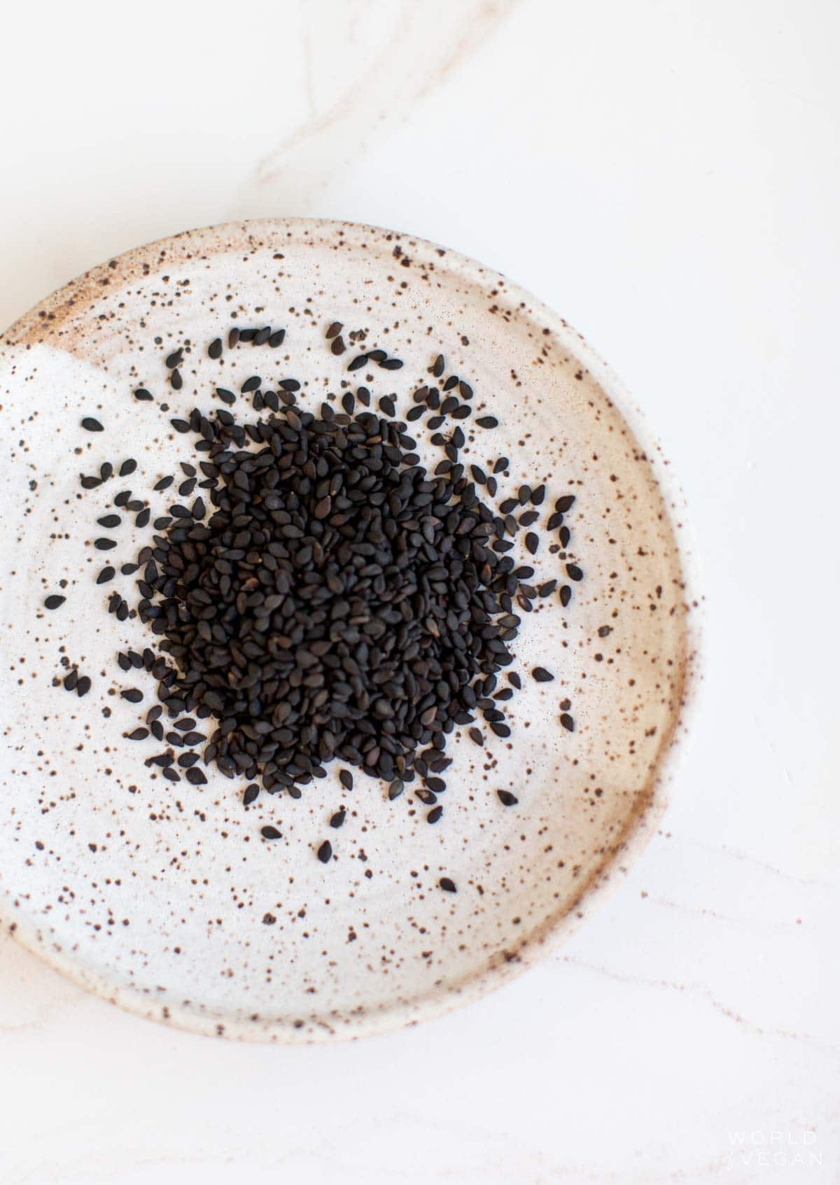 Black sesame seeds in a bowl.