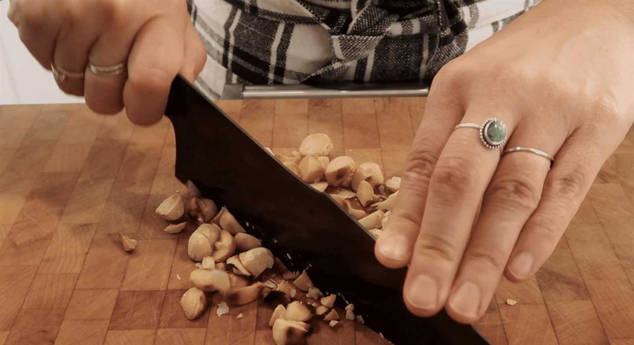 knife chopping macadamia nuts