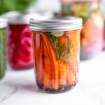 Quick pickled carrots in a jar.